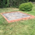 How to Make a Concrete Base for a Greenhouse
